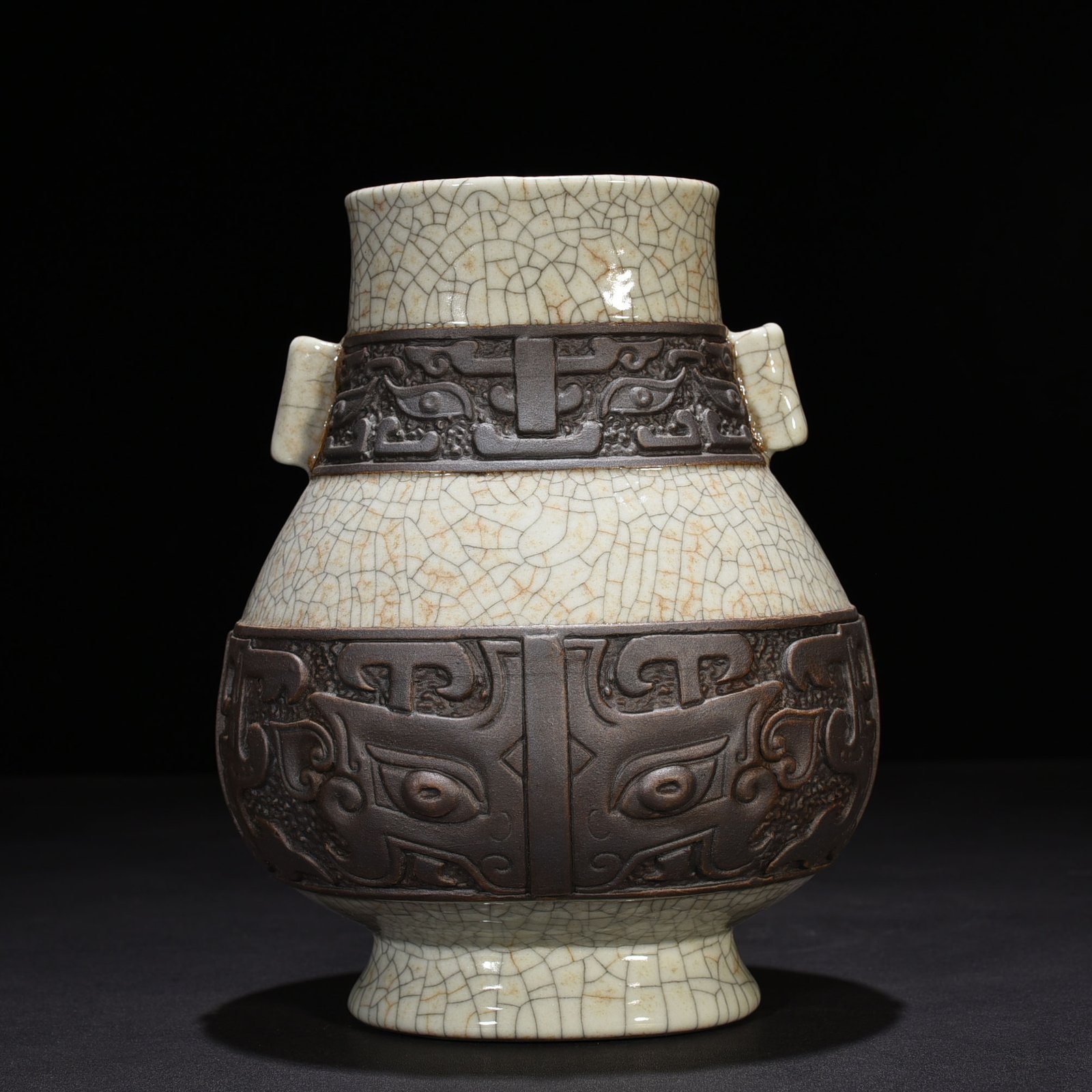 Qing Dynasty Qianlong official kiln carved Taotie pattern through-ear vase