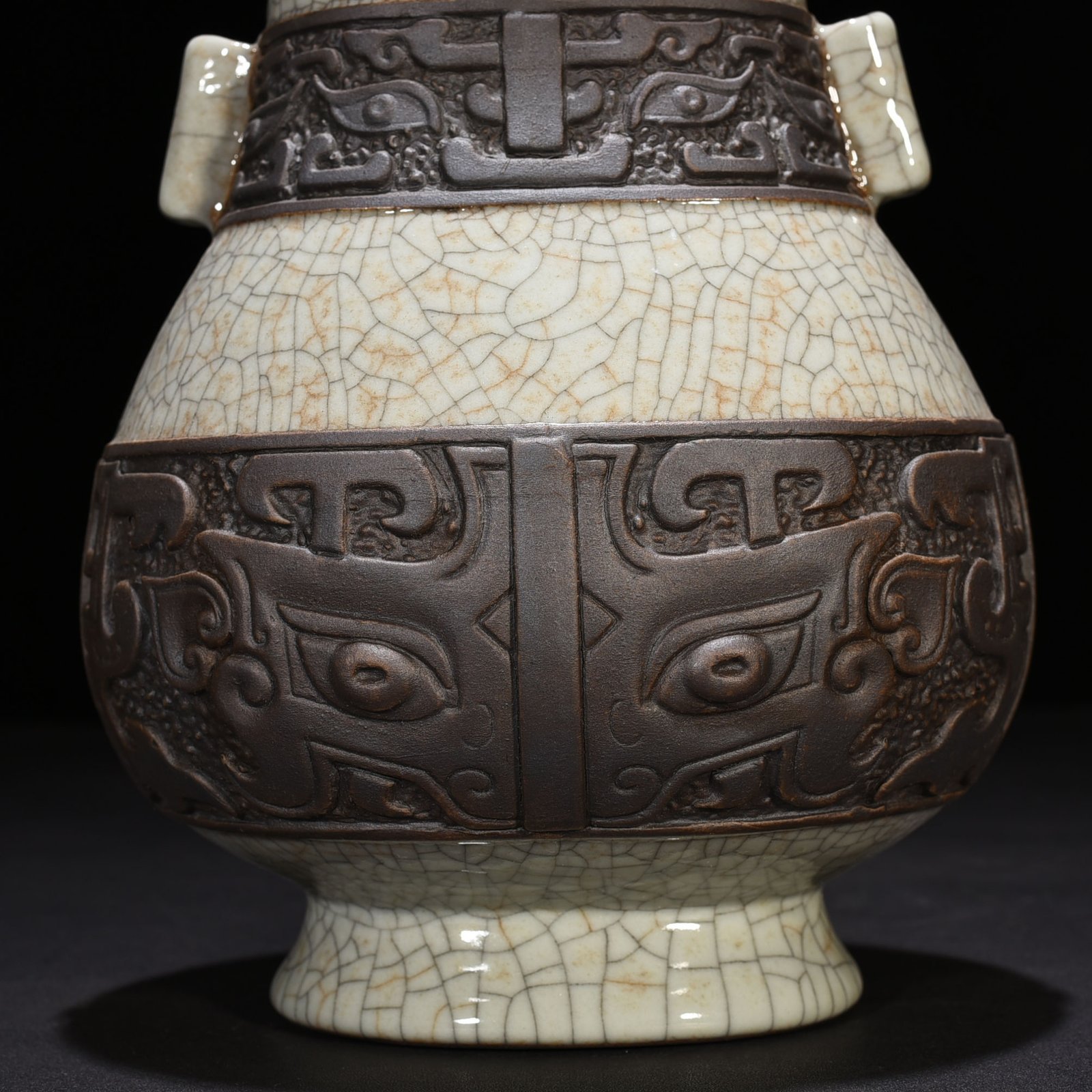 Qing Dynasty Qianlong official kiln carved Taotie pattern through-ear vase