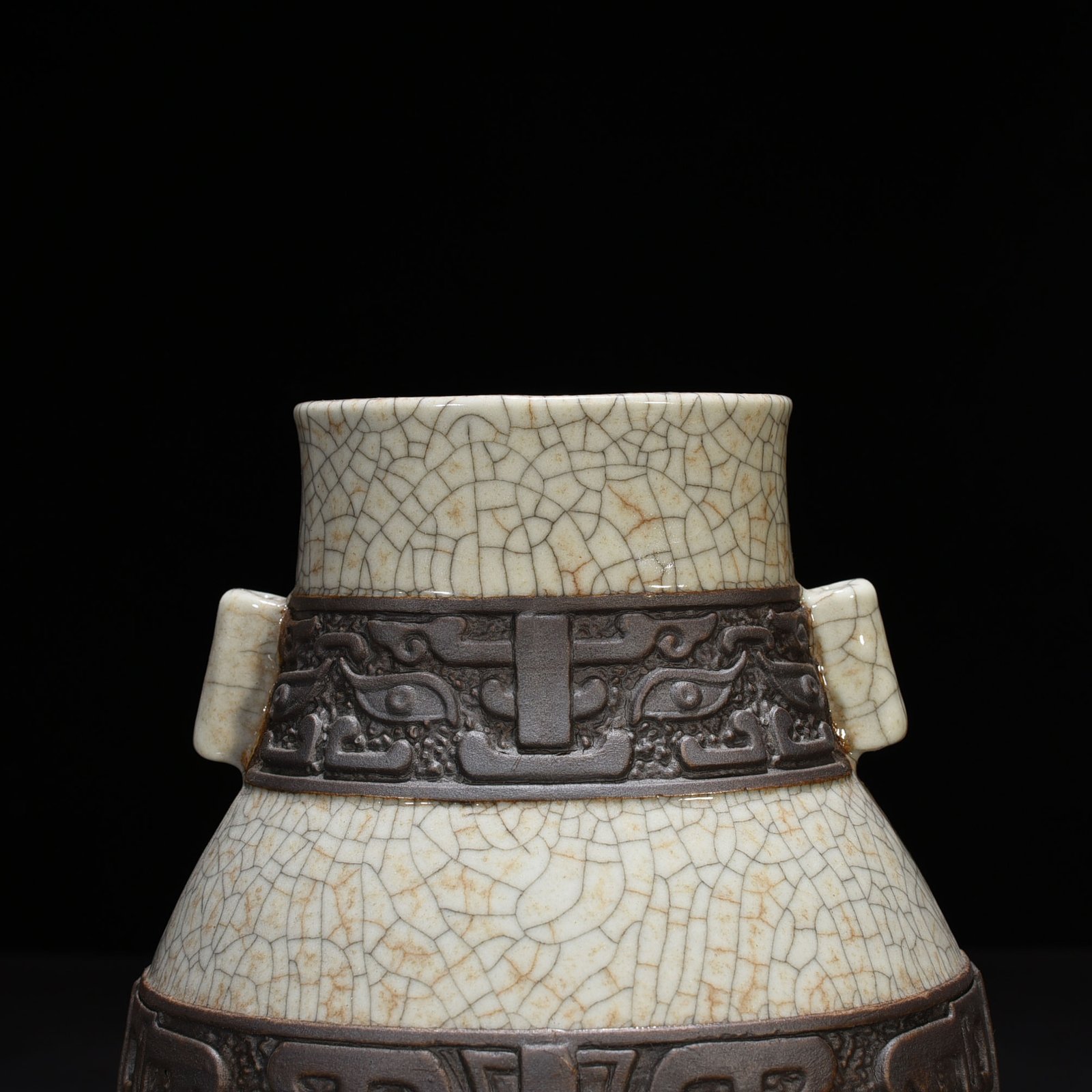 Qing Dynasty Qianlong official kiln carved Taotie pattern through-ear vase