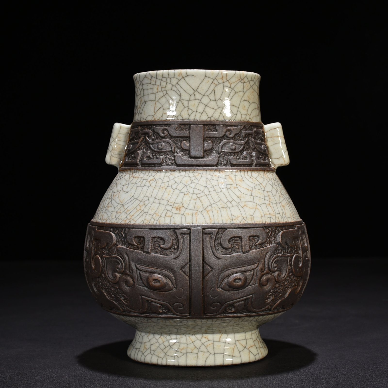 Qing Dynasty Qianlong official kiln carved Taotie pattern through-ear vase
