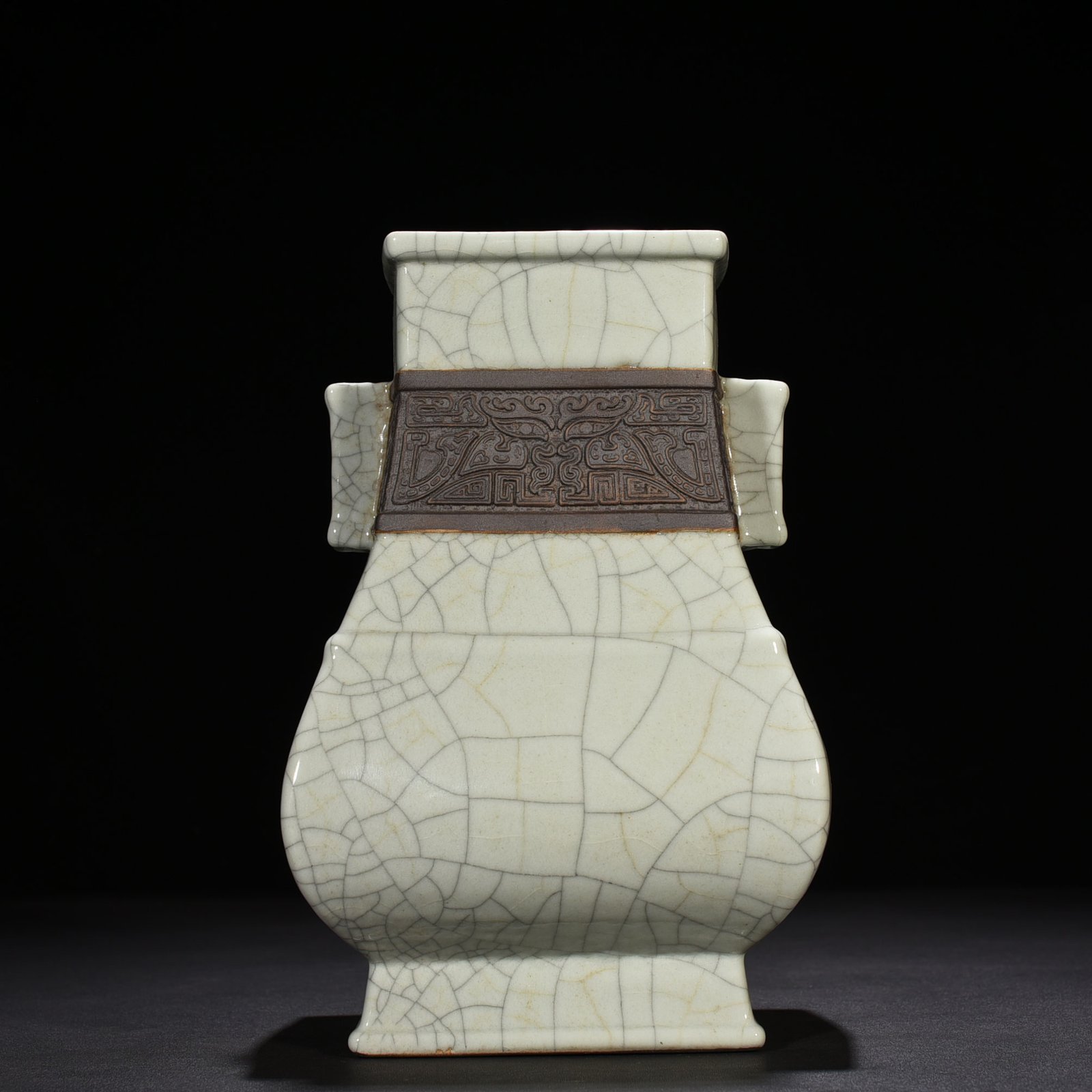 Qing Dynasty Qianlong official kiln carved Taotie pattern through the ear square vase