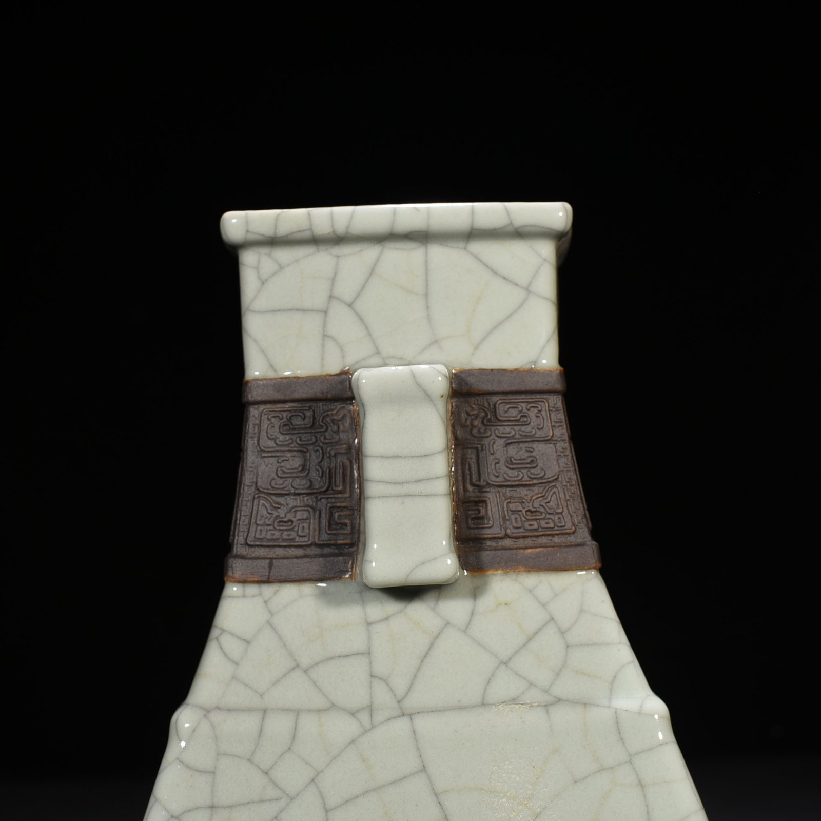 Qing Dynasty Qianlong official kiln carved Taotie pattern through the ear square vase
