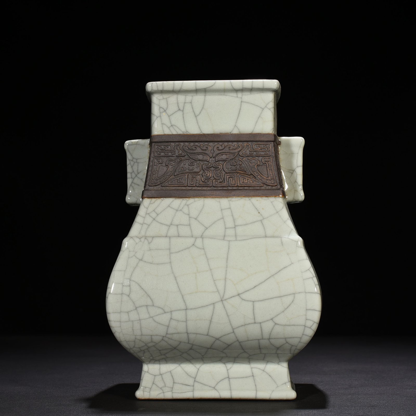 Qing Dynasty Qianlong official kiln carved Taotie pattern through the ear square vase