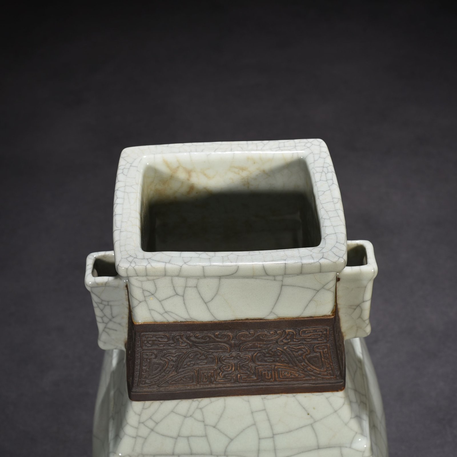 Qing Dynasty Qianlong official kiln carved Taotie pattern through the ear square vase