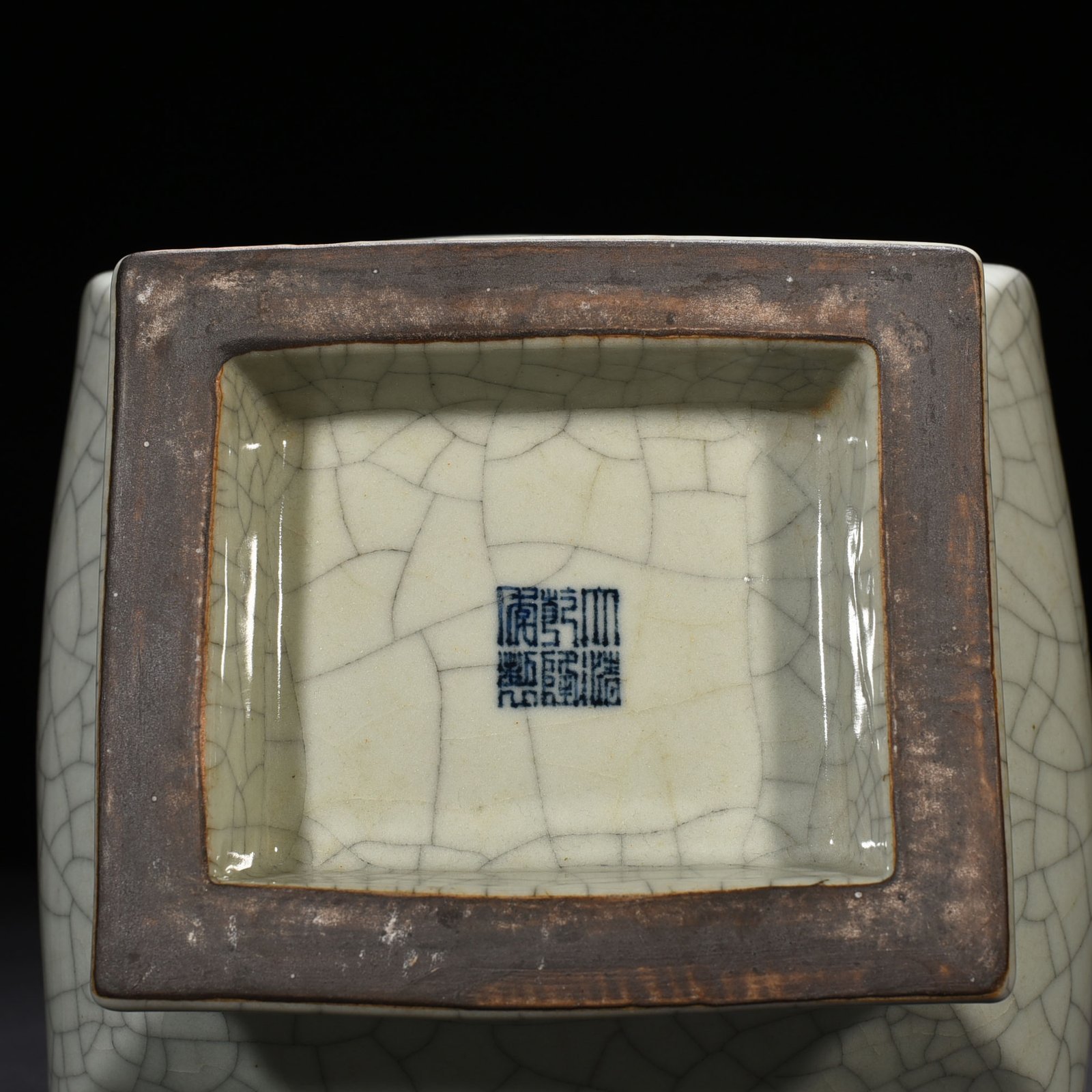 Qing Dynasty Qianlong official kiln carved Taotie pattern through the ear square vase