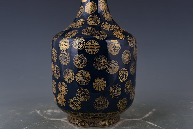 Qing Dynasty Emperor Qianlong imperial blue-glazed garlic vase with gold leather ball pattern