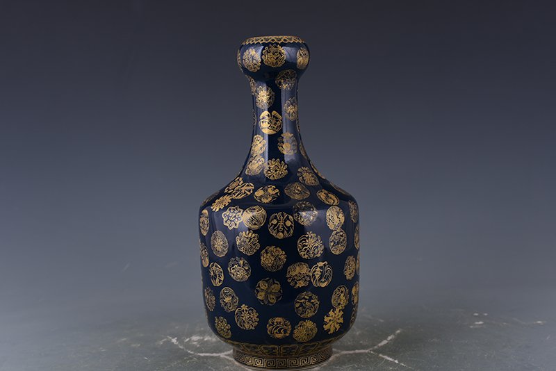 Qing Dynasty Emperor Qianlong imperial blue-glazed garlic vase with gold leather ball pattern