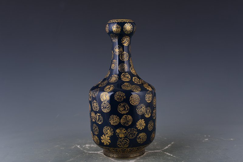 Qing Dynasty Emperor Qianlong imperial blue-glazed garlic vase with gold leather ball pattern