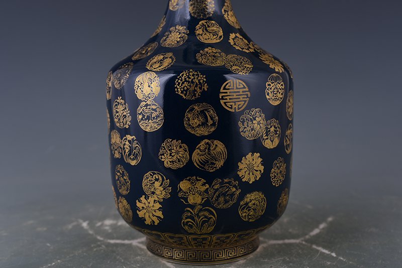 Qing Dynasty Emperor Qianlong imperial blue-glazed garlic vase with gold leather ball pattern