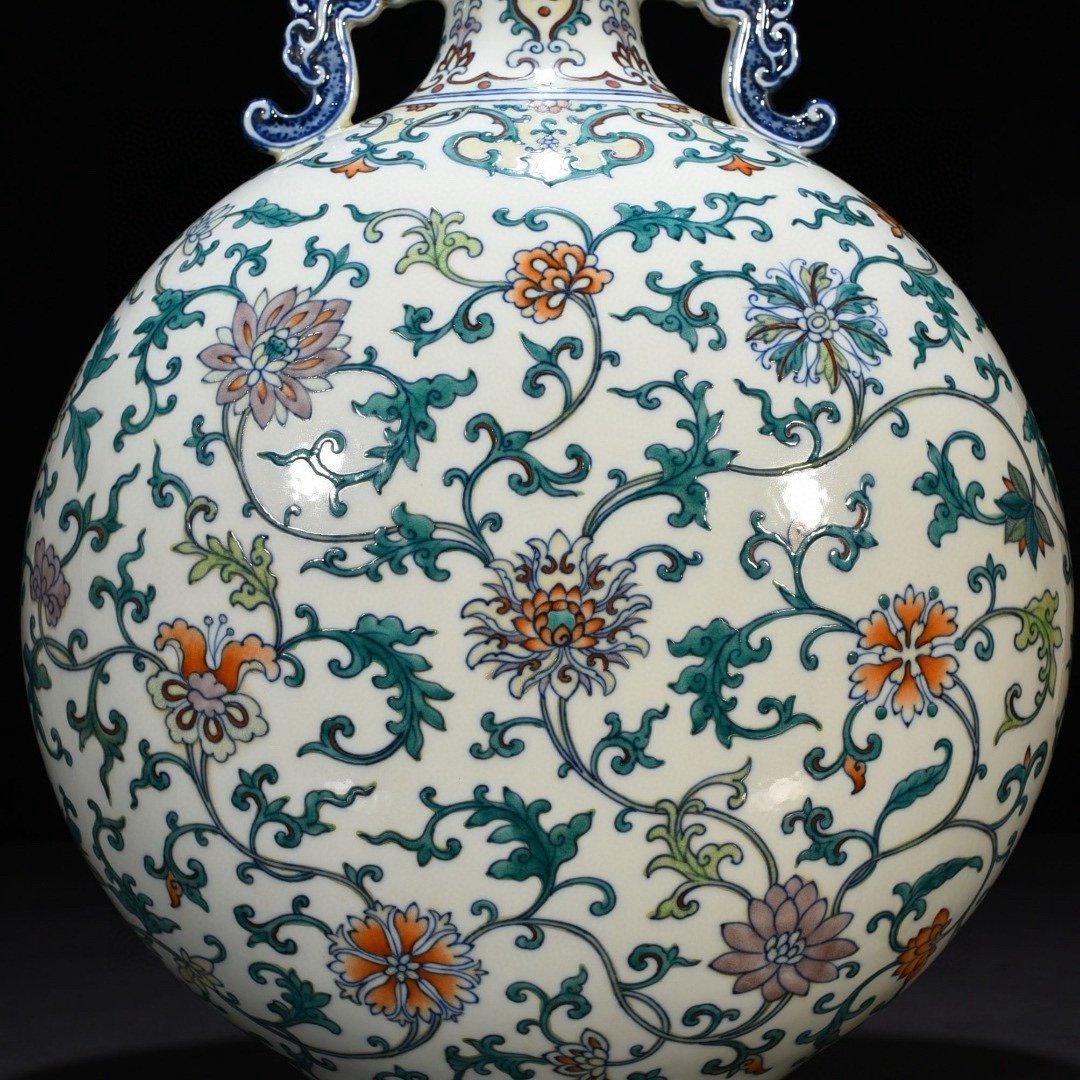 Qing Dynasty Qianlong doucai double-eared flat vase with entwined branches and floral patterns