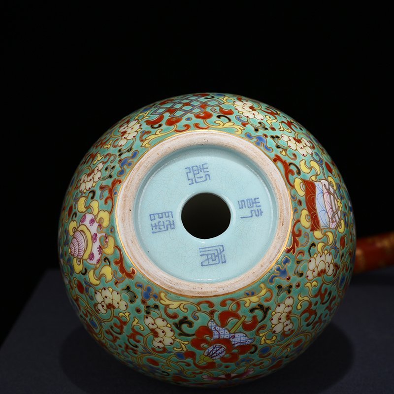 Qing Dynasty Qianlong turquoise green space pastel wrapped branches eight treasure pattern backflow pot