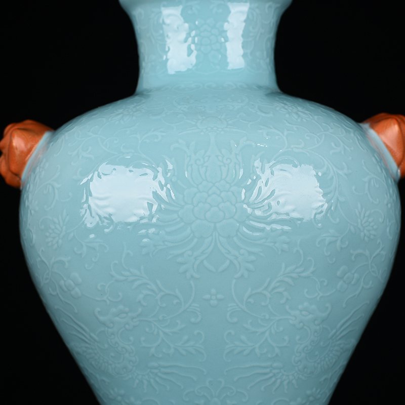 Qing Dynasty Qianlong turquoise green glaze climbing flower entangled branches and phoenix ear-shaped vase