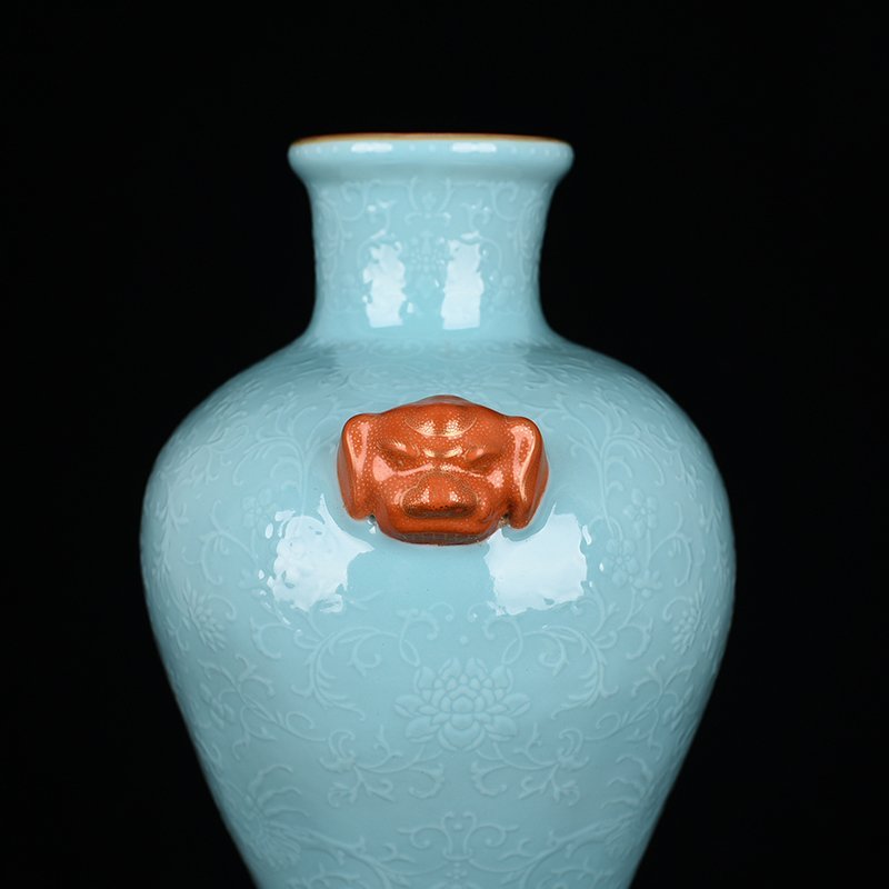 Qing Dynasty Qianlong turquoise green glaze climbing flower entangled branches and phoenix ear-shaped vase