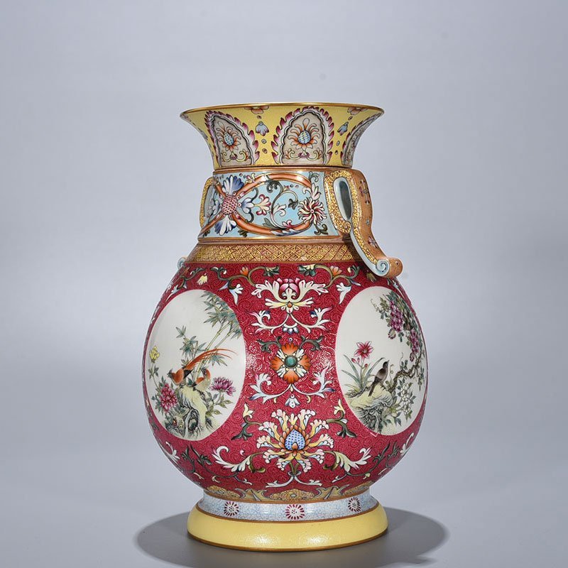 Qing Dynasty Qianlong enamel carmine red rolled four-season flower and bird pattern revolving neck bottle