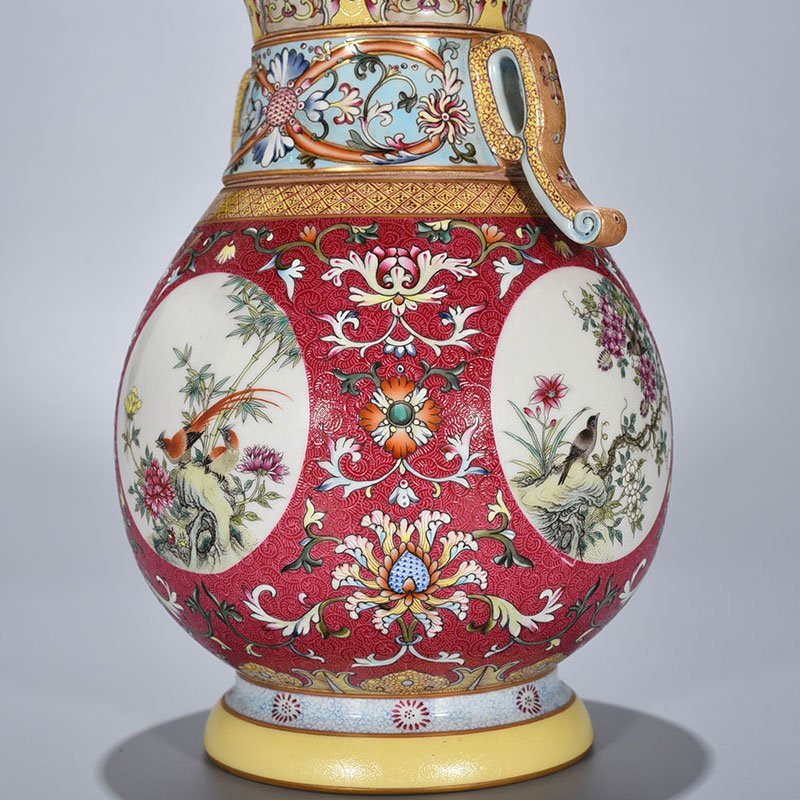 Qing Dynasty Qianlong enamel carmine red rolled four-season flower and bird pattern revolving neck bottle