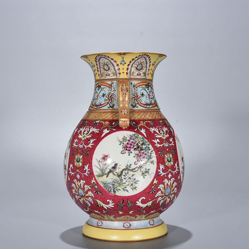 Qing Dynasty Qianlong enamel carmine red rolled four-season flower and bird pattern revolving neck bottle