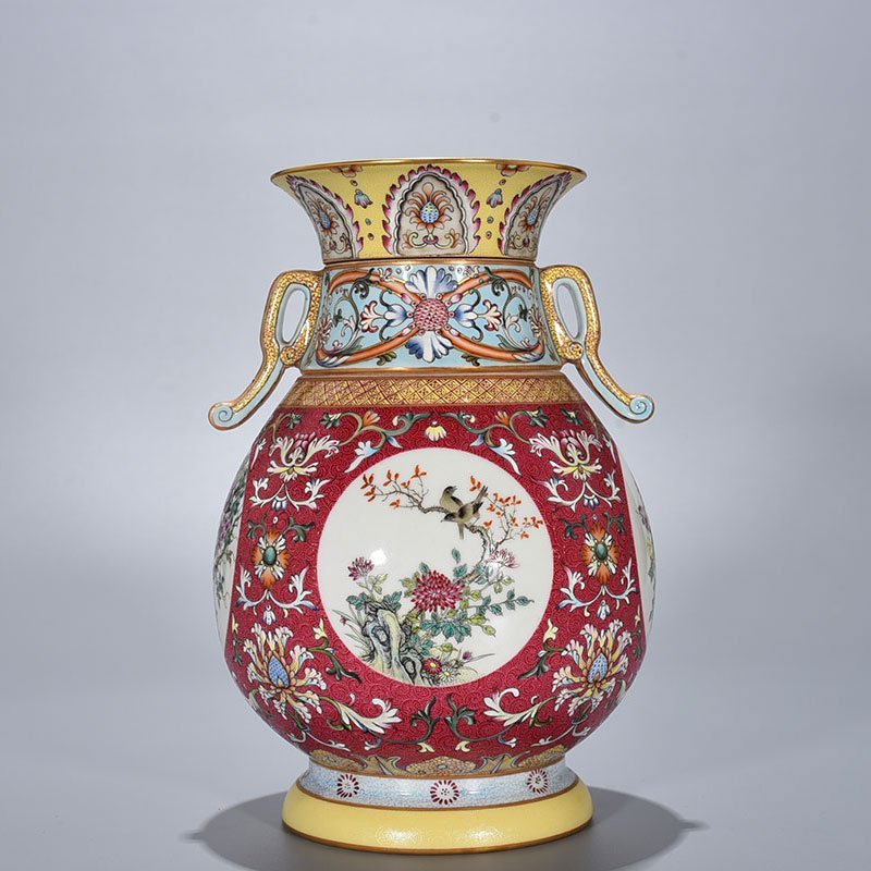 Qing Dynasty Qianlong enamel carmine red rolled four-season flower and bird pattern revolving neck bottle
