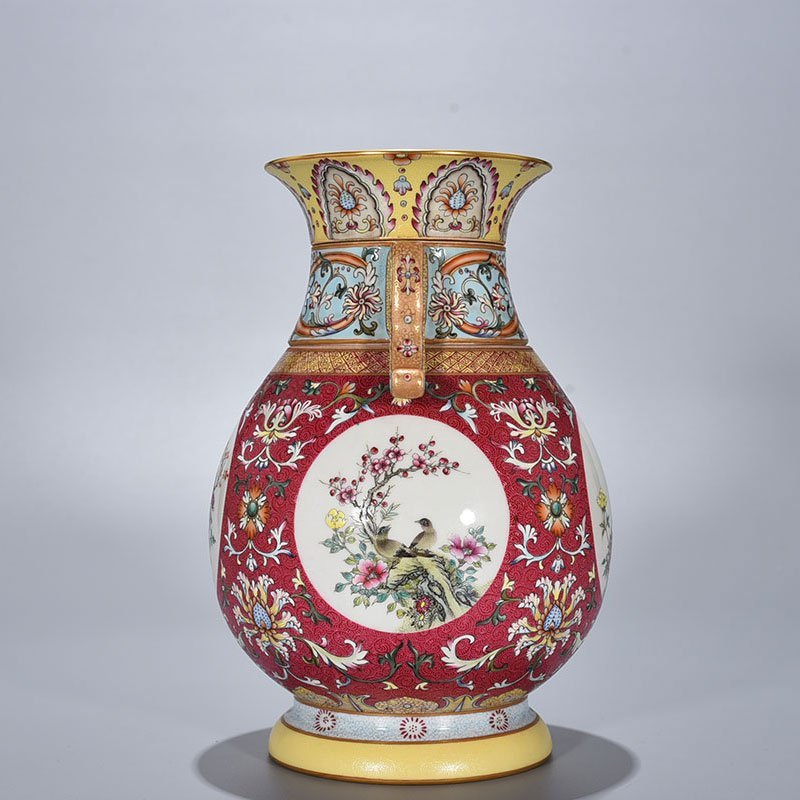 Qing Dynasty Qianlong enamel carmine red rolled four-season flower and bird pattern revolving neck bottle