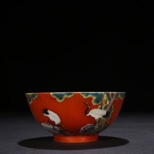 Qing Dynasty Qianlong alum red ground pastel pine and crane longevity pattern bowl