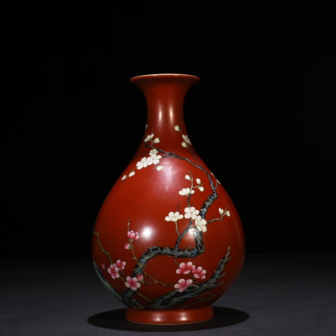 Qing Dynasty Qianlong alum red ground pastel plum pattern jade pot spring vase