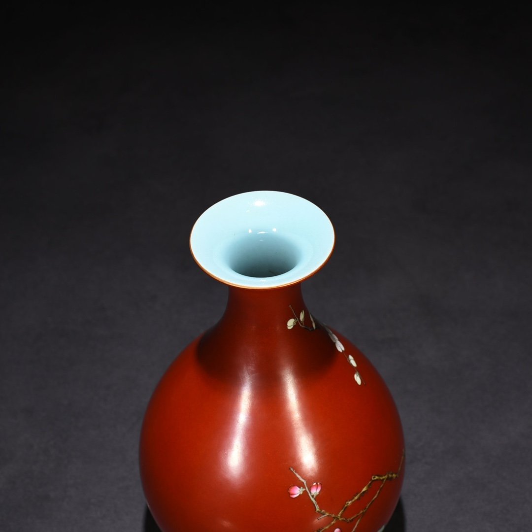 Qing Dynasty Qianlong alum red ground pastel plum pattern jade pot spring vase