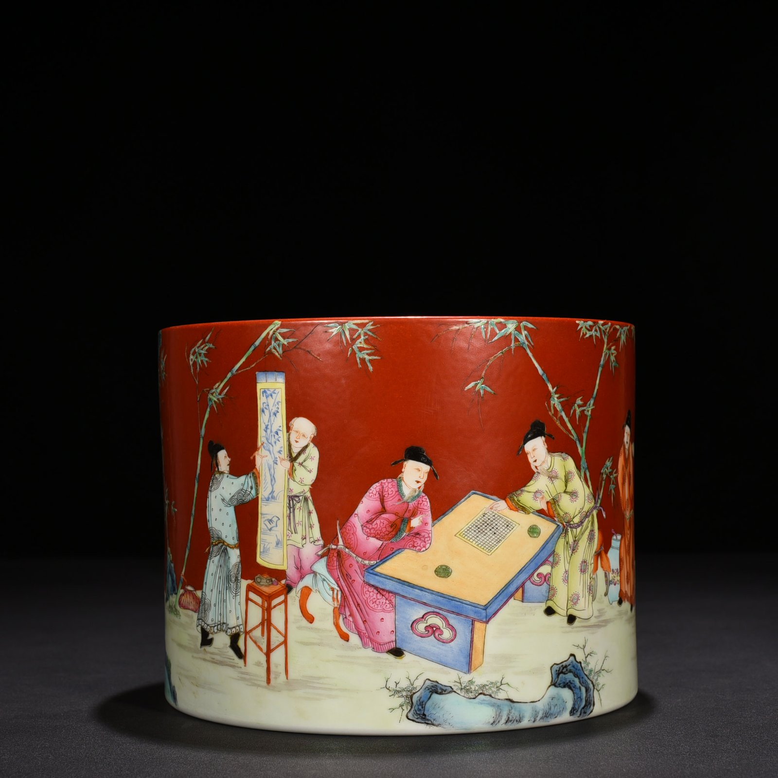 Qing Dynasty Qianlong alum red ground pastel bamboo forest figure pattern pen holder