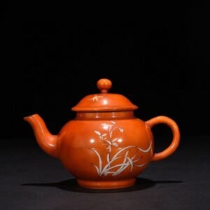 Qing Dynasty Qianlong alum red with white orchid pattern pot