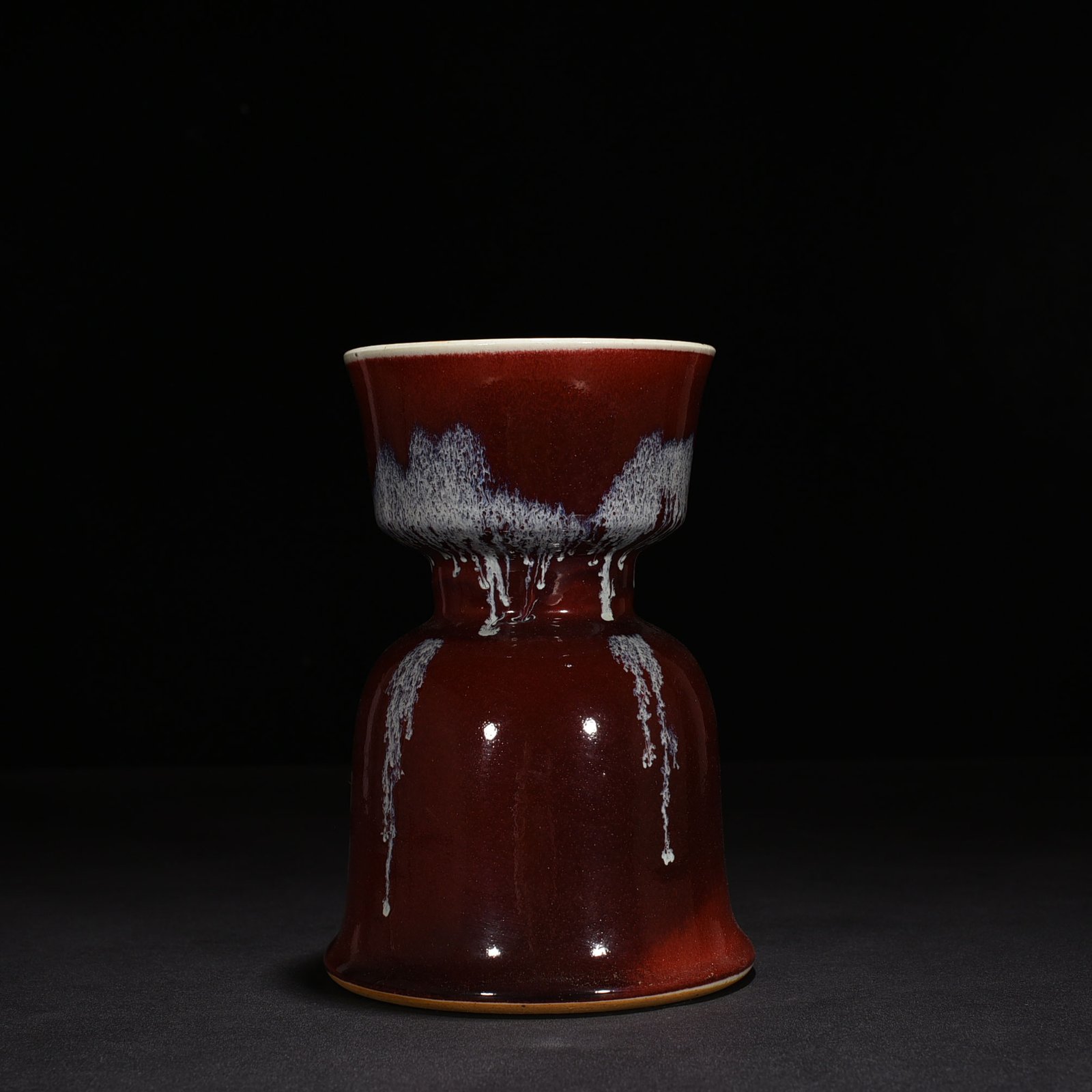 Qing Dynasty Qianlong Festival red glaze candlestick
