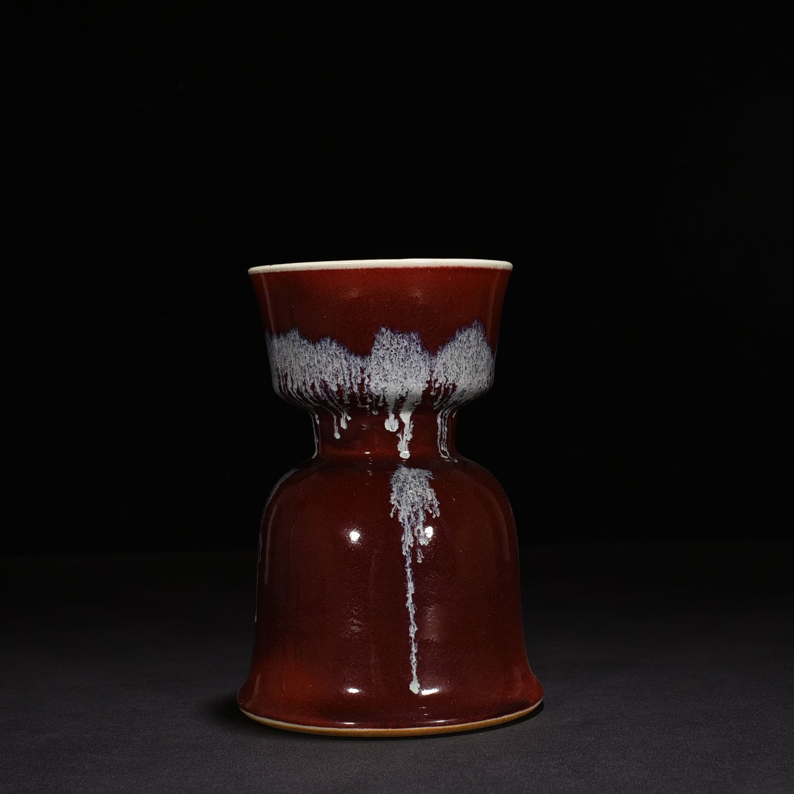 Qing Dynasty Qianlong Festival red glaze candlestick