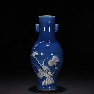 Qing Dynasty Qianlong Festival blue glaze pile-carved flower and bird pattern through-ear vase