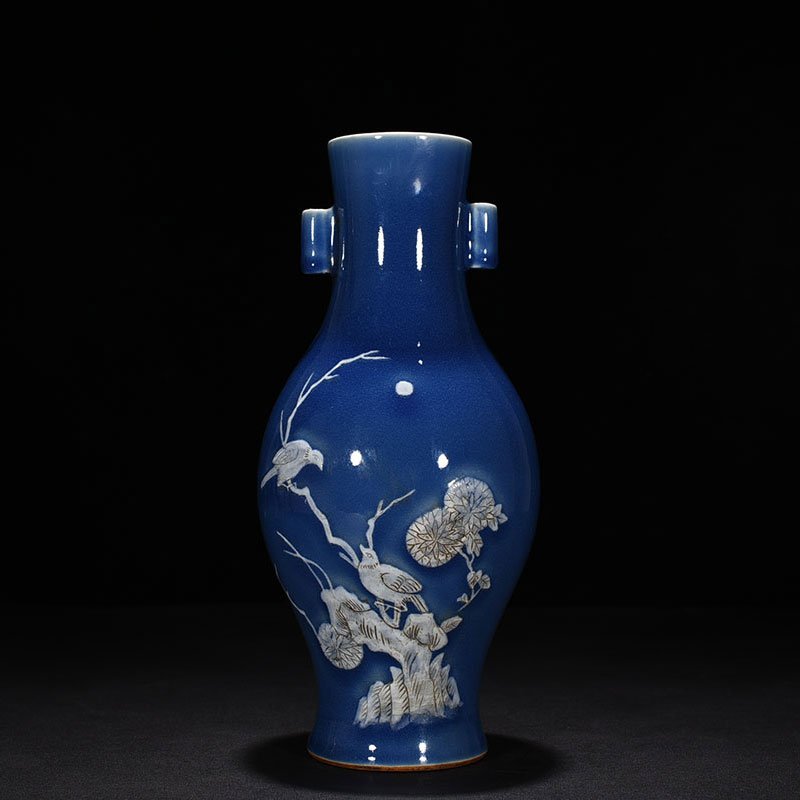 Qing Dynasty Qianlong Festival blue glaze pile-carved flower and bird pattern through-ear vase