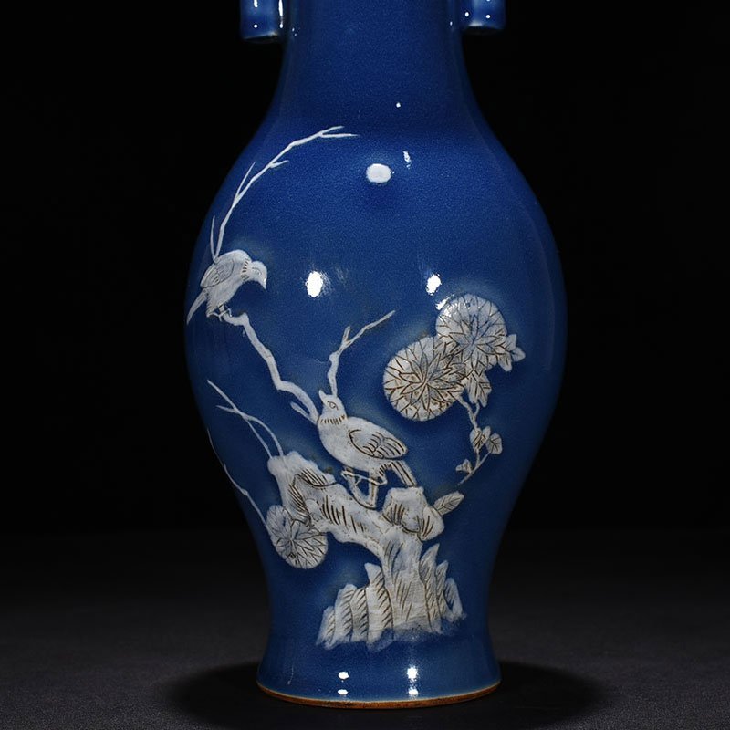 Qing Dynasty Qianlong Festival blue glaze pile-carved flower and bird pattern through-ear vase
