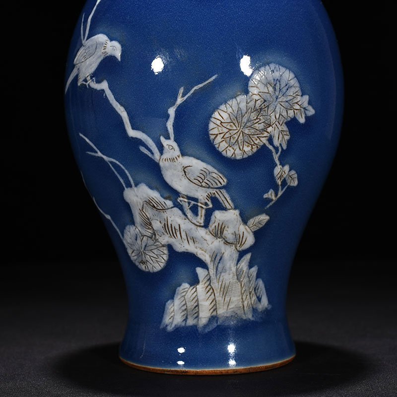 Qing Dynasty Qianlong Festival blue glaze pile-carved flower and bird pattern through-ear vase