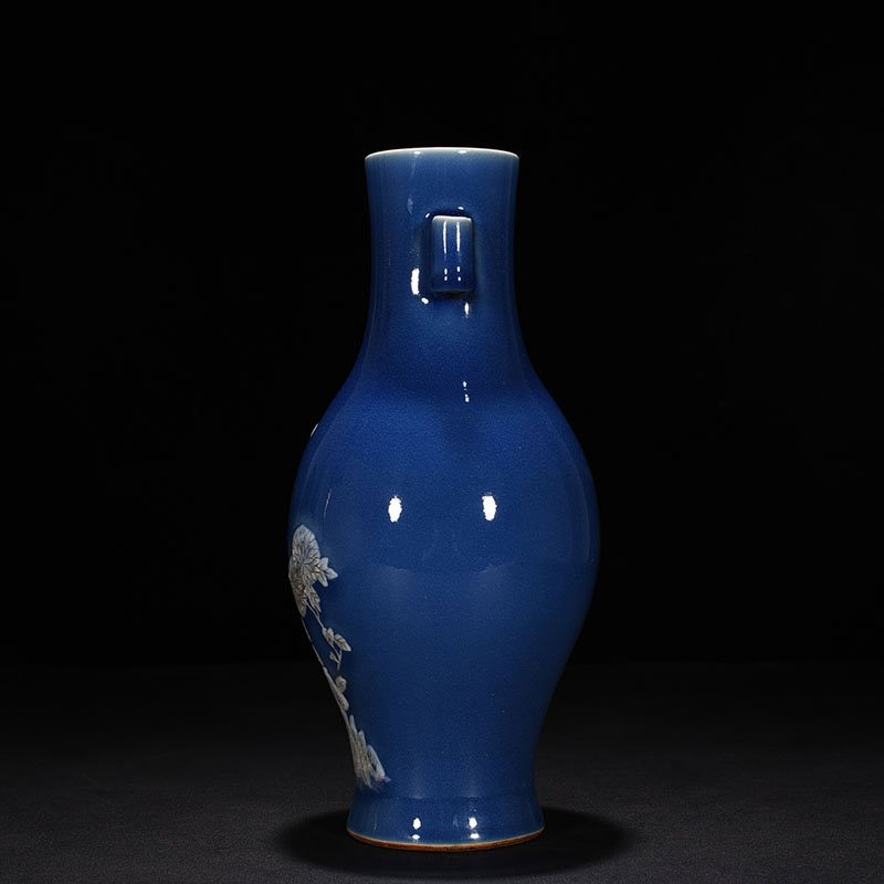 Qing Dynasty Qianlong Festival blue glaze pile-carved flower and bird pattern through-ear vase