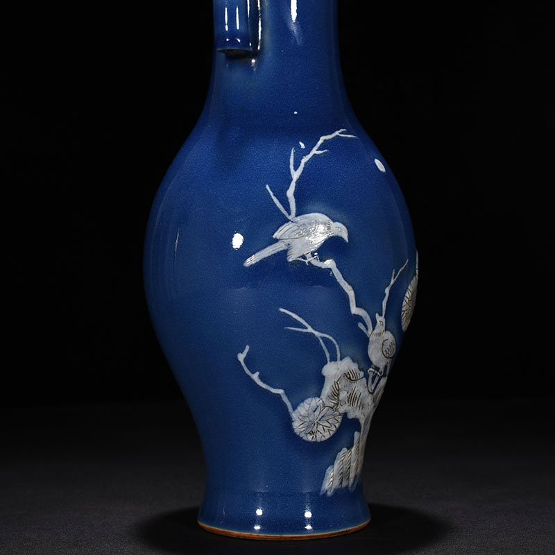 Qing Dynasty Qianlong Festival blue glaze pile-carved flower and bird pattern through-ear vase