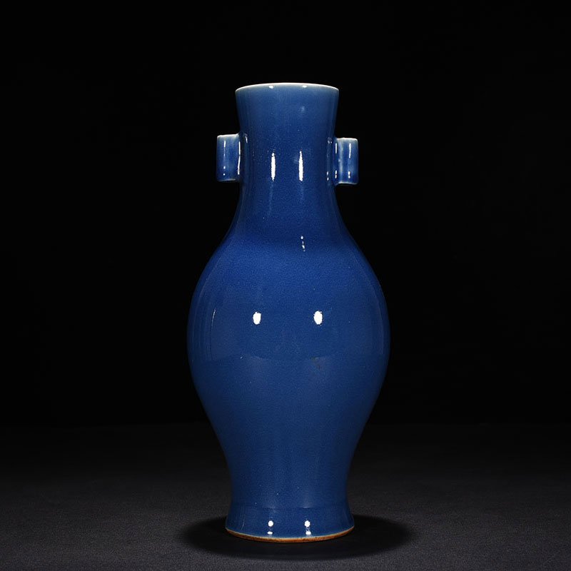 Qing Dynasty Qianlong Festival blue glaze pile-carved flower and bird pattern through-ear vase