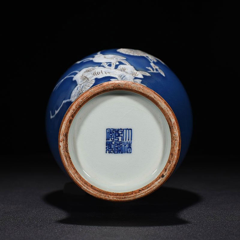Qing Dynasty Qianlong Festival blue glaze pile-carved flower and bird pattern through-ear vase