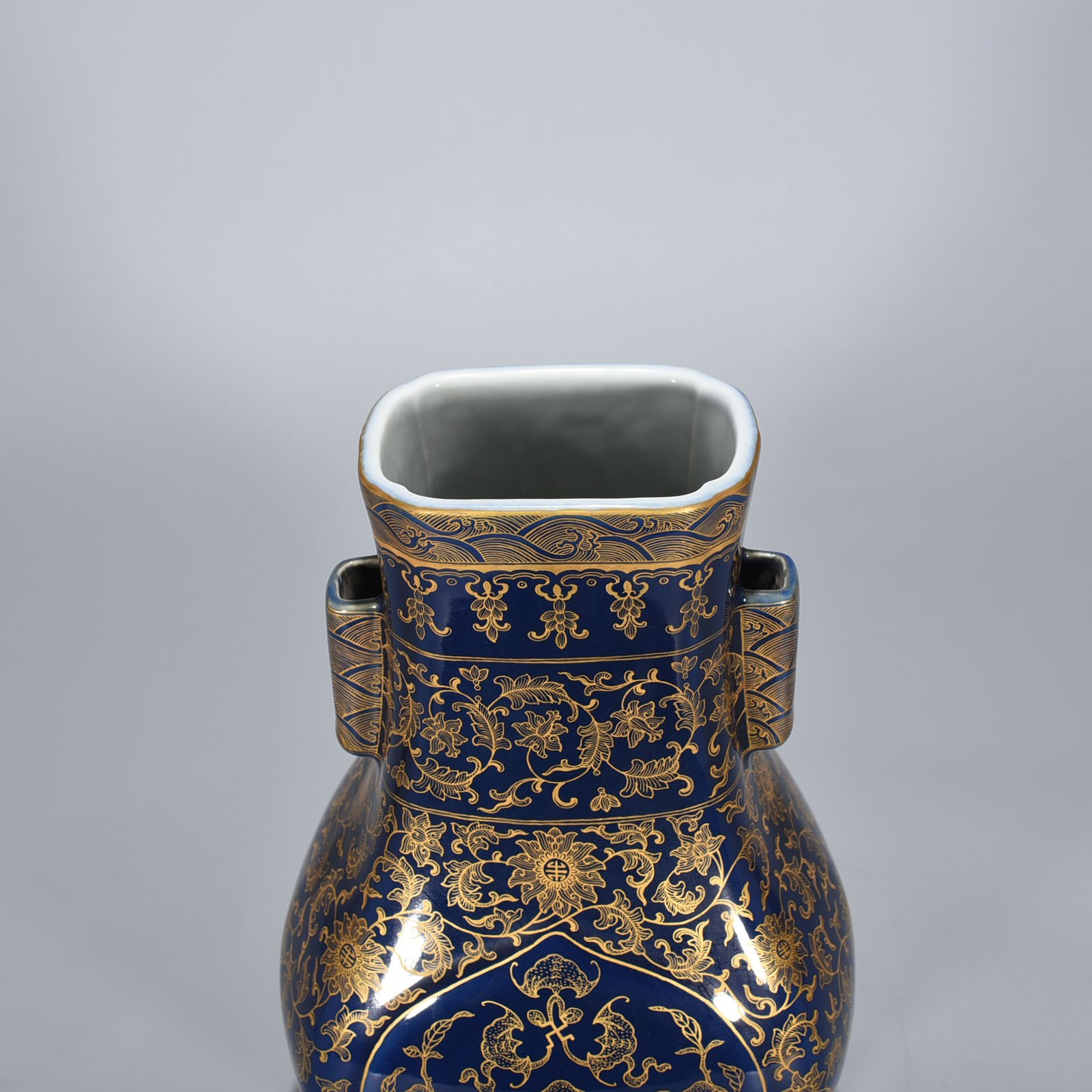 Qing Dynasty Qianlong Festival blue-glazed gold-painted five-blessing holder apricot round ears square vase