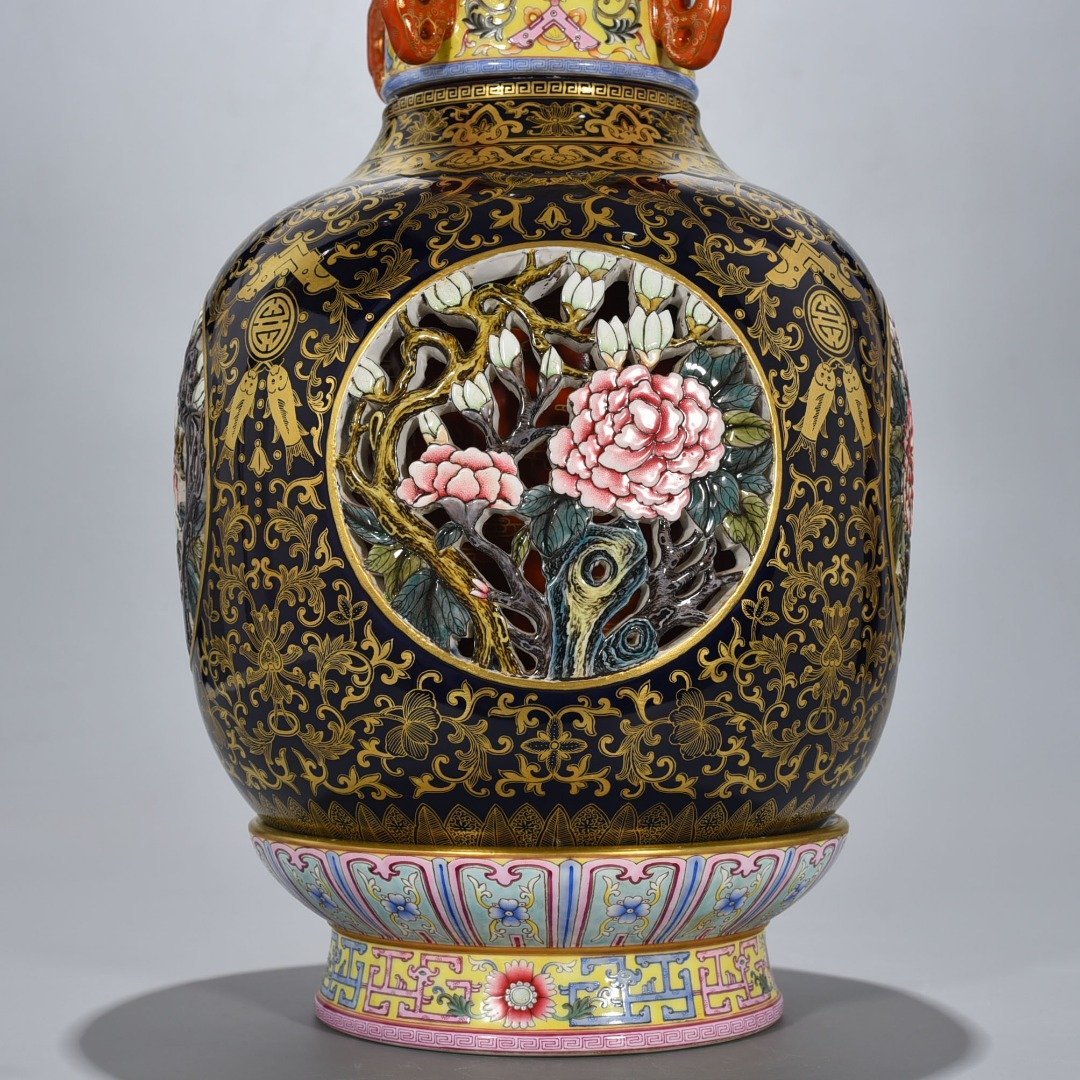Qing Dynasty Qianlong Festival blue glaze painted gold hollow four seasons flower pattern revolving vase
