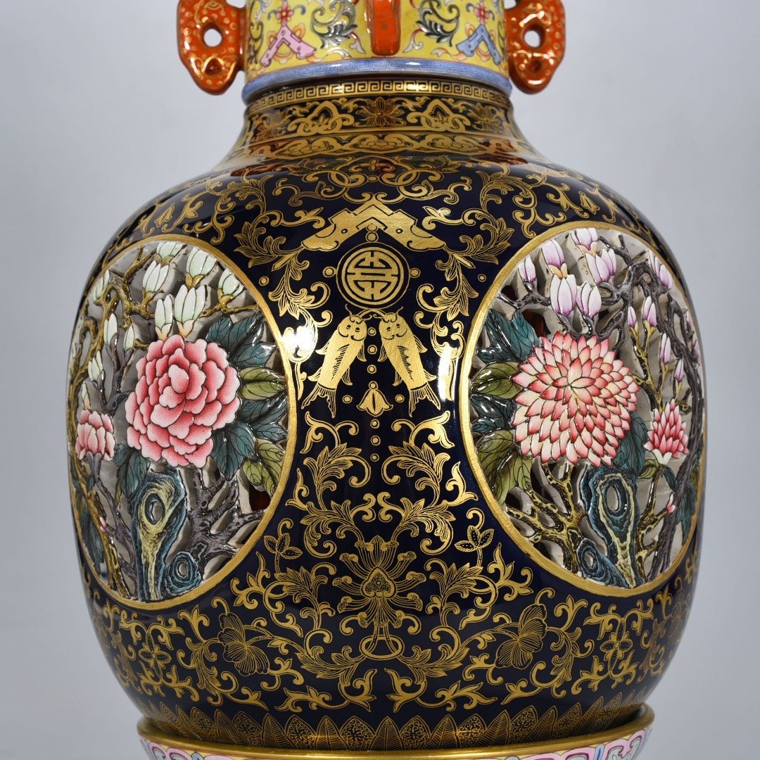 Qing Dynasty Qianlong Festival blue glaze painted gold hollow four seasons flower pattern revolving vase