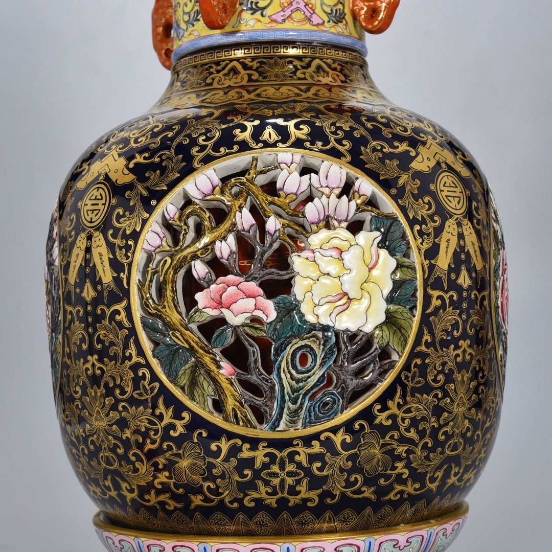 Qing Dynasty Qianlong Festival blue glaze painted gold hollow four seasons flower pattern revolving vase