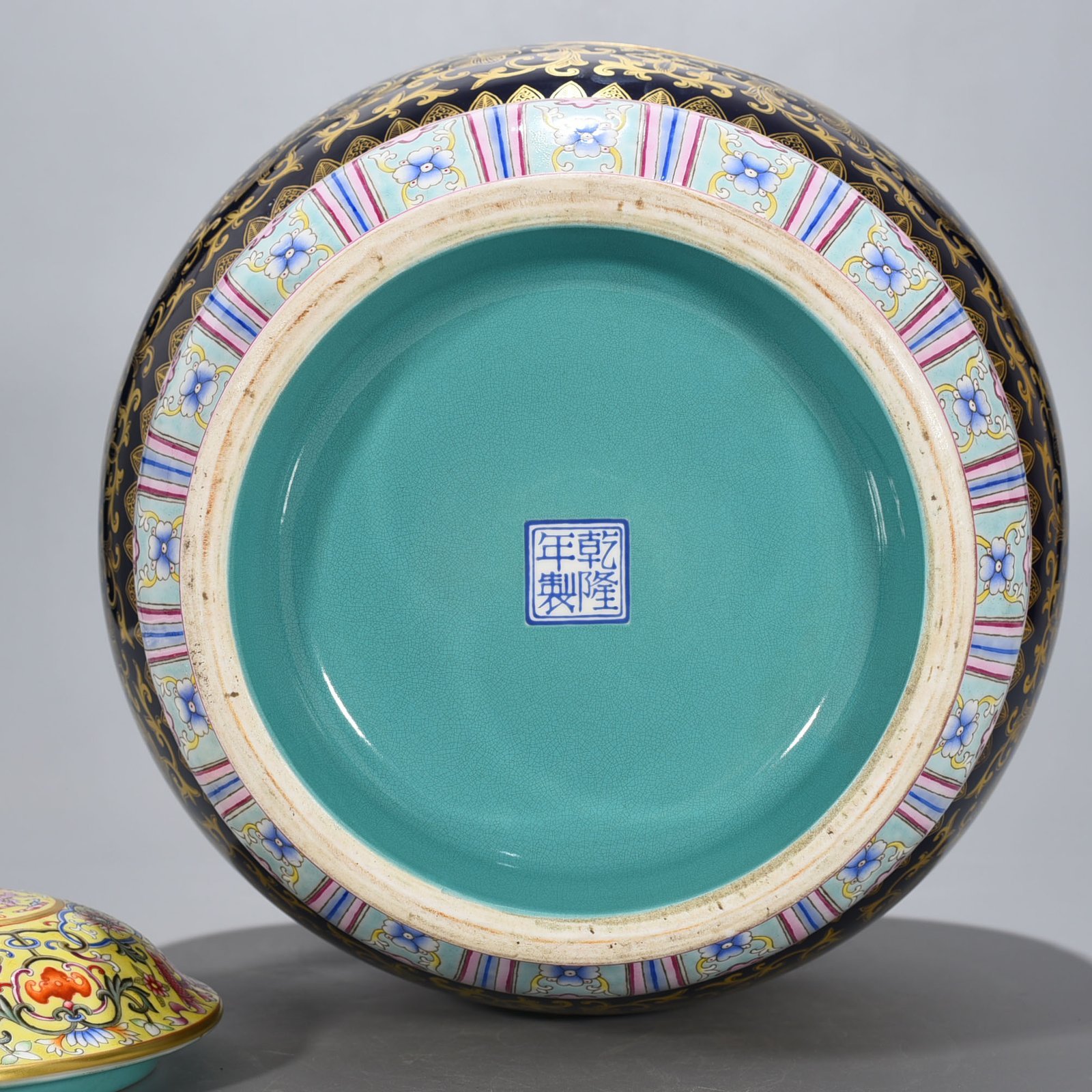 Qing Dynasty Qianlong Festival blue glaze painted gold hollow four seasons flower pattern revolving vase