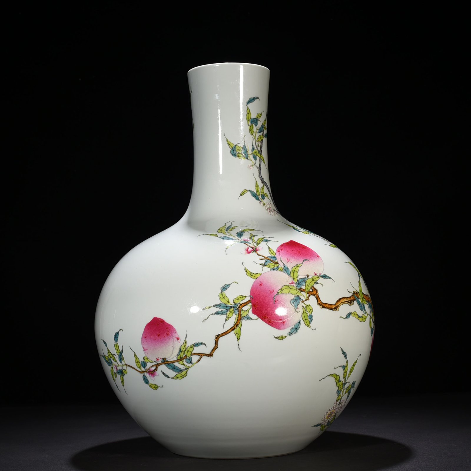 Qing Dynasty Qianlong famille rose nine-peach pattern celestial sphere vase