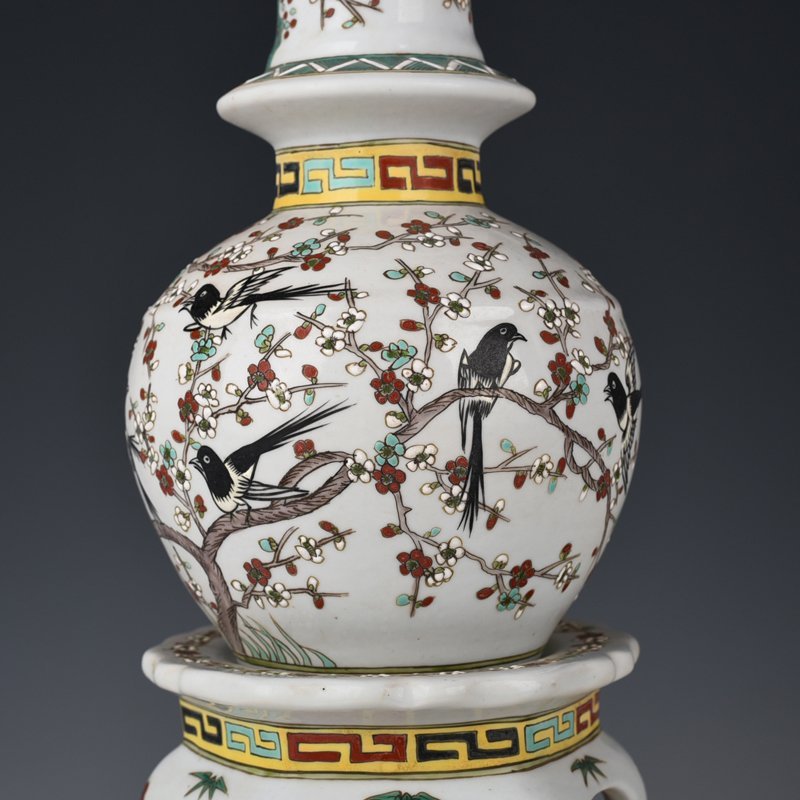 Qing Dynasty Qianlong pastel magpie and plum blossom vase