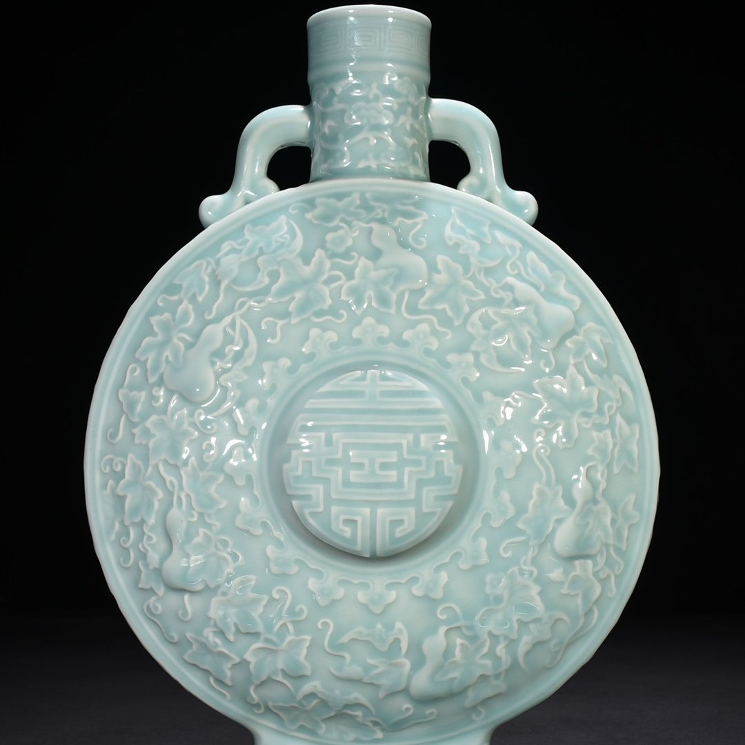 Qing Dynasty Qianlong pink celadon glaze descendants all generations holding moon vase