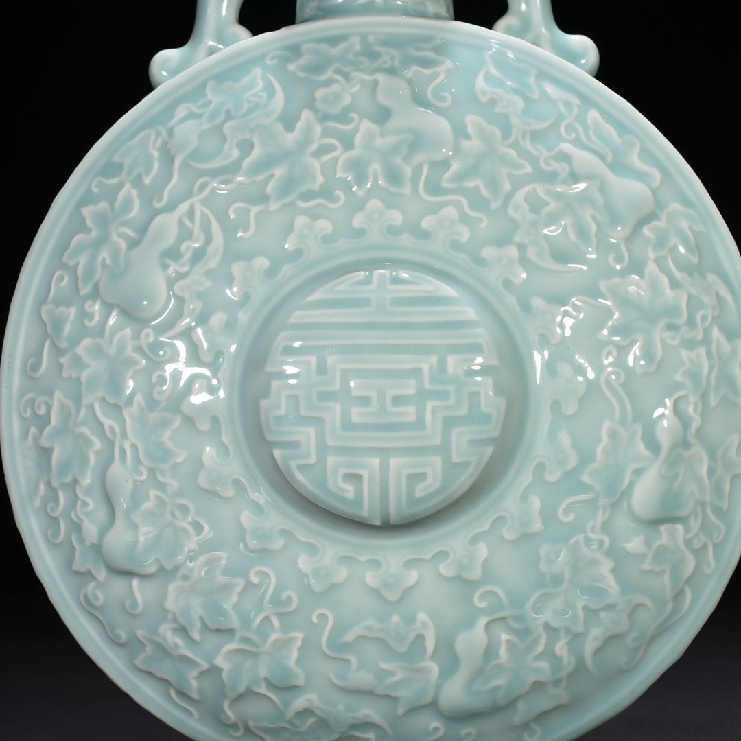 Qing Dynasty Qianlong pink celadon glaze descendants all generations holding moon vase