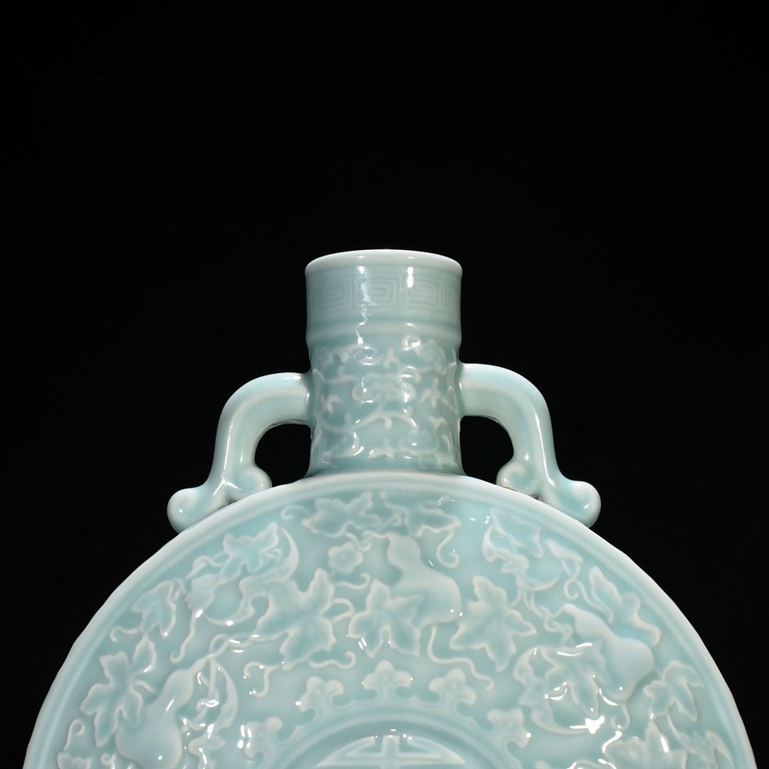 Qing Dynasty Qianlong pink celadon glaze descendants all generations holding moon vase