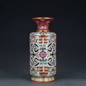 Qing Dynasty Qianlong pink celadon enamel flower hollow bagua vase