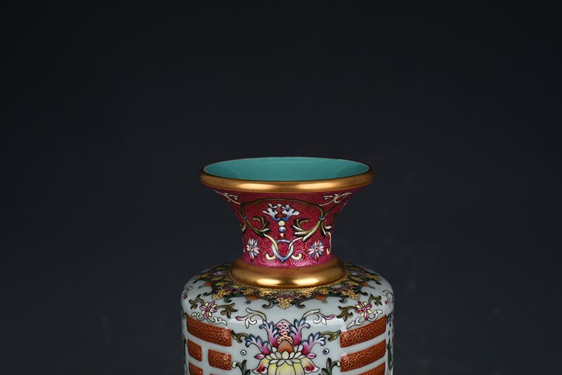 Qing Dynasty Qianlong pink celadon enamel flower hollow bagua vase