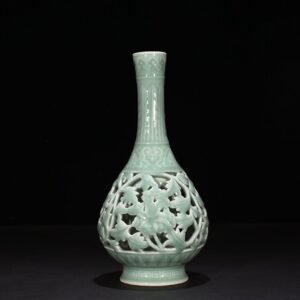 Qing Dynasty Qianlong pink celadon glaze hollow vase with entwined branches and floral patterns
